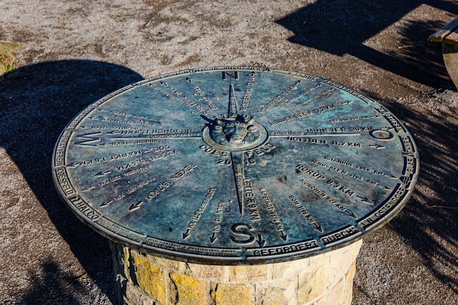 A detailed view of the compass rose direction indicator in Coesfeld, Germany, under bright daylight.
